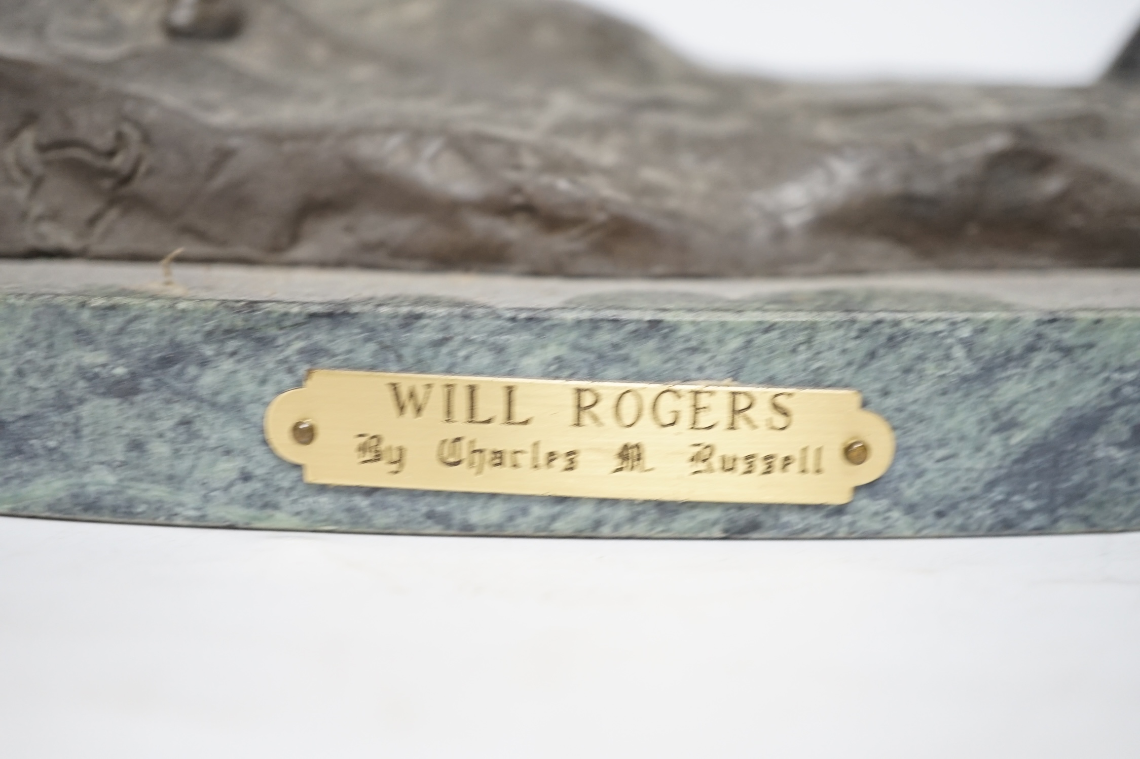 After Charles Marian Russell, a bronze group of Will Rogers, 29cm high